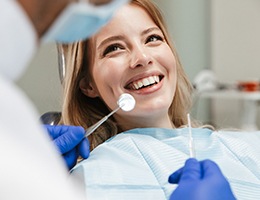 Woman smiling during dental checkup and cleaning