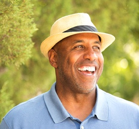 man with All-on-4 in Mesquite, TX smiling among trees