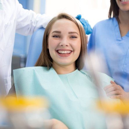 implant dentist in Mesquite holding a model of All-on-4