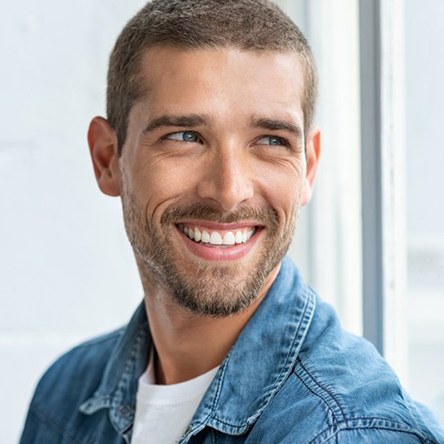 a man smiling with bright teeth