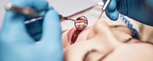 Dentist conducting exam on patient