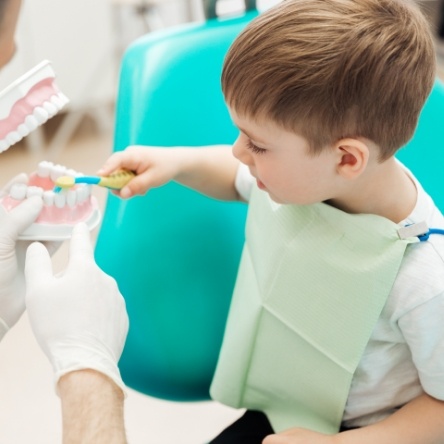 A young child having her dental exam