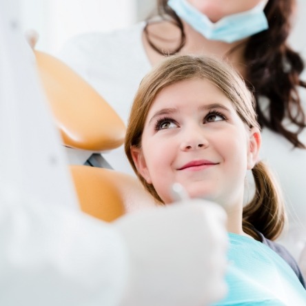 A child receiving a fluoride varnish