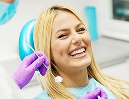 Laughing woman in dental chair