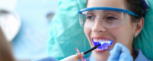 A woman receiving dental bonding 