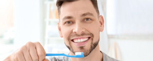 man with toothbrush