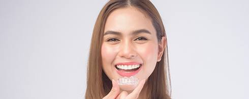 Woman with Invisalign in Mesquite smiling