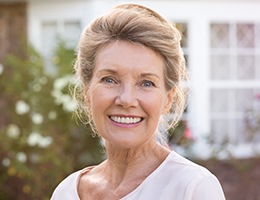 Smiling older woman outdoors