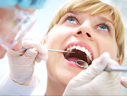 Woman receiving dental exam