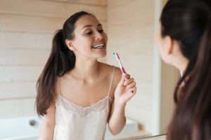 person brushing their teeth