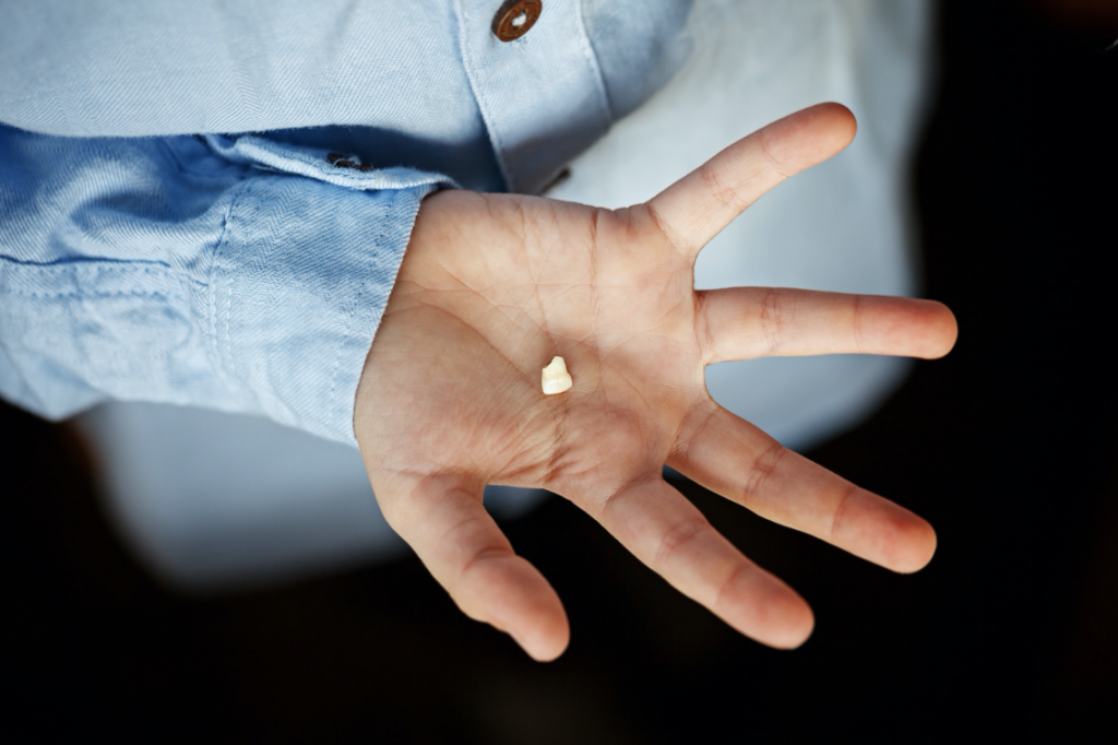 hand holding dental filling   