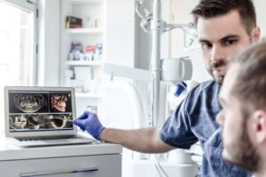 Dentist and patient discussing tooth replacement options